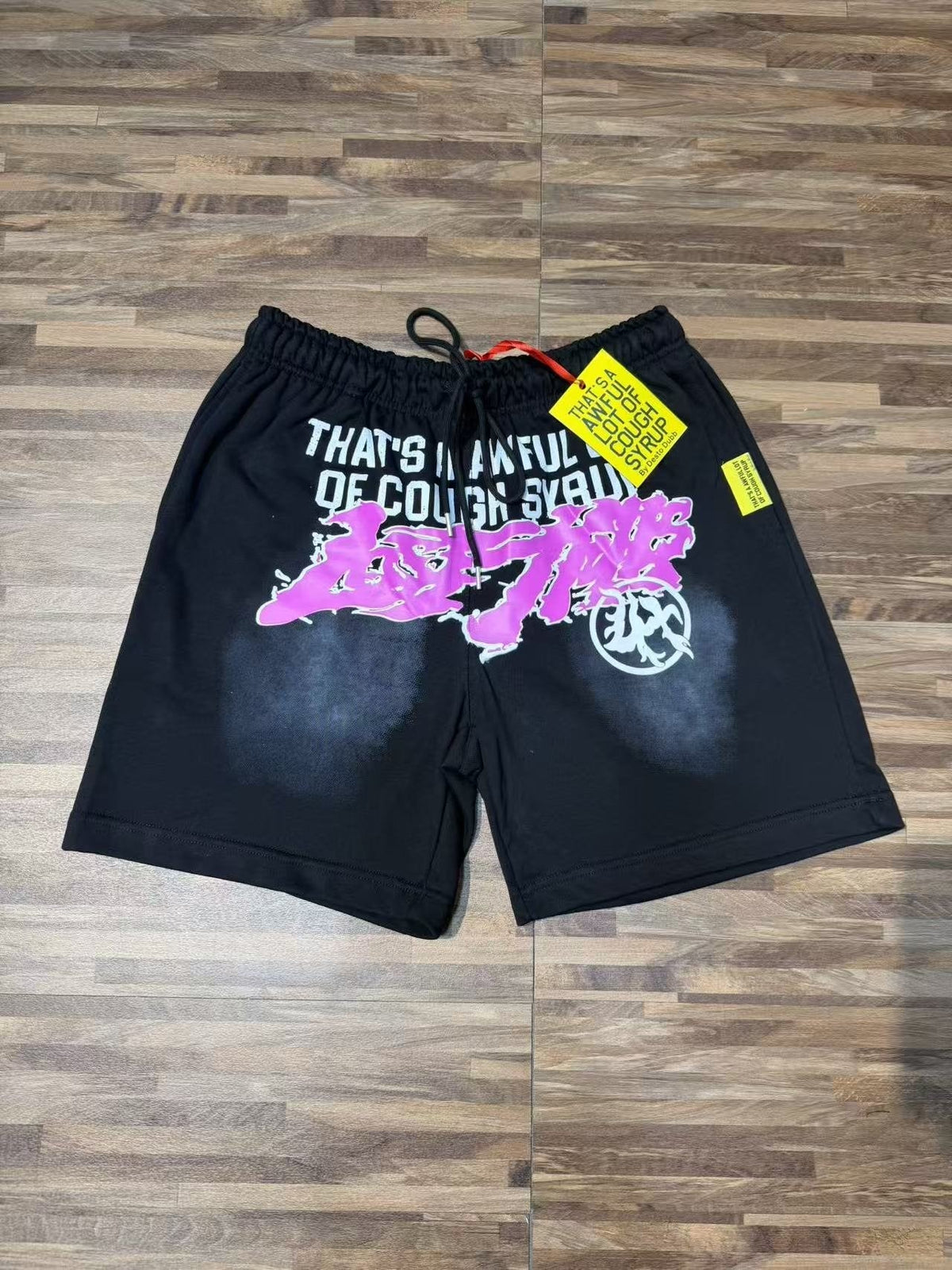 THAT'S A AWFUL LOT OF COUGH SYRUP Black Front Graphic Shorts